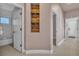 Hallway with built-in shelves and access to bathroom and laundry at 120 Emerald Dunes Cir, Henderson, NV 89052