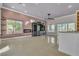 Spacious living room with tile floors and built-in entertainment center at 120 Emerald Dunes Cir, Henderson, NV 89052