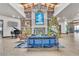 Lobby with grand fireplace, seating area, and Christmas decor at 120 Emerald Dunes Cir, Henderson, NV 89052