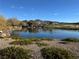 Serene pond with mountain backdrop at 120 Emerald Dunes Cir, Henderson, NV 89052