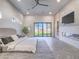 Main bedroom with fireplace, herringbone floors, and sliding glass doors at 309 Rosegate Ave, Henderson, NV 89052