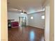 Spacious living room featuring hardwood floors, fireplace, and sliding glass doors at 4021 Gliding Gulls Ave, North Las Vegas, NV 89084