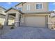 Charming home featuring a covered entryway with stone accents and a brick driveway at 4343 Countryside Glen Ct, North Las Vegas, NV 89084