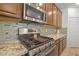 Close up of the stainless steel gas range cooktop and microwave at 4343 Countryside Glen Ct, North Las Vegas, NV 89084