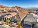 Aerial view of homes with solar panels and desert landscape at 56 Tatahatso Point St, Henderson, NV 89011