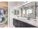 Double vanity bathroom with walk-in closet access at 56 Tatahatso Point St, Henderson, NV 89011