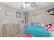 Well-lit bedroom with a twin bed, dresser, and playful decor at 6341 W Haleh Ave, Las Vegas, NV 89141