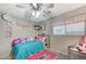 Charming bedroom with a twin-size bed, colorful decor, and plenty of storage at 6341 W Haleh Ave, Las Vegas, NV 89141