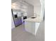 Bright kitchen features stainless steel appliances, white cabinets, and modern countertops at 7255 W Sunset Rd # 2046, Las Vegas, NV 89113