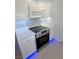 Modern kitchen with white cabinets, stainless steel appliances, and stylish backsplash at 7255 W Sunset Rd # 2046, Las Vegas, NV 89113