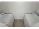 A laundry room with two white appliances and neutral walls and flooring at 7255 W Sunset Rd # 2046, Las Vegas, NV 89113