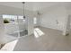 Open living room with lots of natural light, patio access, and ceiling fan at 7255 W Sunset Rd # 2046, Las Vegas, NV 89113