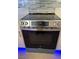 Modern stainless steel oven with glass cooktop and digital display; blue led floor lighting at 7255 W Sunset Rd # 2046, Las Vegas, NV 89113