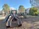 Fun community playground with slides and play structures in a safe, landscaped area at 7255 W Sunset Rd # 2046, Las Vegas, NV 89113