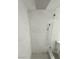Frameless shower stall featuring custom tile and a rain shower head at 7255 W Sunset Rd # 2046, Las Vegas, NV 89113