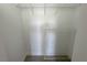 A walk-in closet with wire shelves in an empty room with neutral walls and flooring at 7255 W Sunset Rd # 2046, Las Vegas, NV 89113