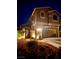 Night view of two-story house with attached garage and landscaping at 7573 Tuckaway Harbor St, Las Vegas, NV 89139