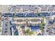 Aerial view of community with a pool, palm trees, and condo buildings at 2056 Mesquite Ln # 303, Laughlin, NV 89029