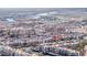 Aerial view of a community with palm trees, pools, condo buildings and a lake at 2056 Mesquite Ln # 303, Laughlin, NV 89029