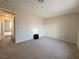 This bedroom features neutral walls, carpet flooring, and access to the hallway at 2056 Mesquite Ln # 303, Laughlin, NV 89029