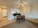 Dining area with bar seating adjacent to kitchen with modern lighting at 2056 Mesquite Ln # 303, Laughlin, NV 89029