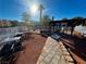 Landscaped grilling area with picnic tables and grills for outdoor dining with trees at 2056 Mesquite Ln # 303, Laughlin, NV 89029