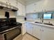 Updated kitchen with stainless steel oven and white cabinetry at 2056 Mesquite Ln # 303, Laughlin, NV 89029