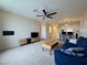 Open-concept living area with modern furniture and a ceiling fan at 2056 Mesquite Ln # 303, Laughlin, NV 89029