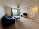 Cozy living room featuring a comfortable blue couch, ceiling fan and a view at 2056 Mesquite Ln # 303, Laughlin, NV 89029