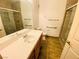 Updated bathroom with modern vanity, tile flooring, and glass shower at 2100 Black Island St # 101, Las Vegas, NV 89128