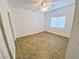 Neutral bedroom featuring bright natural light and wood-look tile flooring at 2100 Black Island St # 101, Las Vegas, NV 89128