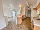 Bright kitchen featuring tile countertops and flooring adjacent to the living space at 2100 Black Island St # 101, Las Vegas, NV 89128