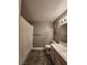 Neutral-toned bathroom featuring a shower-tub combo and a vanity with cabinets at 2725 S Nellis Blvd # 1105, Las Vegas, NV 89121