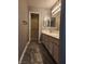 Bathroom featuring a vanity with cabinets, tile flooring and shower access at 2725 S Nellis Blvd # 1105, Las Vegas, NV 89121