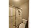 Bathroom with shower, commode, and tiled walls at 2725 S Nellis Blvd # 1105, Las Vegas, NV 89121