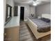 Cozy bedroom with gray walls, hardwood floors, and a window seat with pillows at 2725 S Nellis Blvd # 1105, Las Vegas, NV 89121
