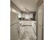 White kitchen featuring neutral countertops, white appliances, and natural lighting at 2725 S Nellis Blvd # 1105, Las Vegas, NV 89121