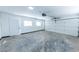 Spacious garage with white walls and a large garage door at 4138 El Segundo Ave, Las Vegas, NV 89121