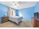 Bedroom with a double bed and blue walls at 5145 Tennis Ct, Las Vegas, NV 89120