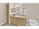 Bathroom with light wood vanity, double sinks and a bathtub at 8000 W Badura Ave # 2106, Las Vegas, NV 89113