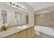 Bathroom with light wood vanity, single sink and bathtub at 8000 W Badura Ave # 2106, Las Vegas, NV 89113