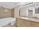 Clean bathroom with granite countertop, a bathtub and shower at 8000 W Badura Ave # 2106, Las Vegas, NV 89113