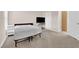 Bright bedroom with carpet flooring, a tv stand and an ensuite bathroom at 8000 W Badura Ave # 2106, Las Vegas, NV 89113