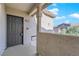 Building entryway with a gray door and walkway at 8000 W Badura Ave # 2106, Las Vegas, NV 89113