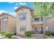 Two-story condo building with private balcony and landscaping at 8000 W Badura Ave # 2106, Las Vegas, NV 89113