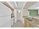 Modern kitchen with stainless steel appliances and light wood cabinets at 8000 W Badura Ave # 2106, Las Vegas, NV 89113