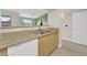 Kitchen with double sink, dishwasher, and view to living area at 8000 W Badura Ave # 2106, Las Vegas, NV 89113