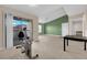 Open living area with kitchen and exercise bike at 8000 W Badura Ave # 2106, Las Vegas, NV 89113