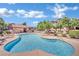 Community swimming pool with lounge chairs at 8000 W Badura Ave # 2106, Las Vegas, NV 89113