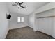 Simple bedroom with carpet, a window, and closet at 1002 Harp Way, North Las Vegas, NV 89032